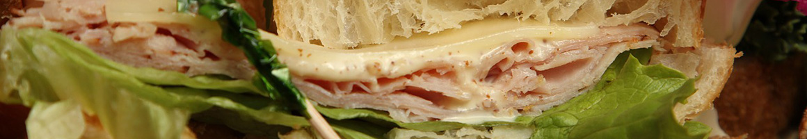 Eating Sandwich at DiBella's Subs restaurant in Bingham Farms, MI.